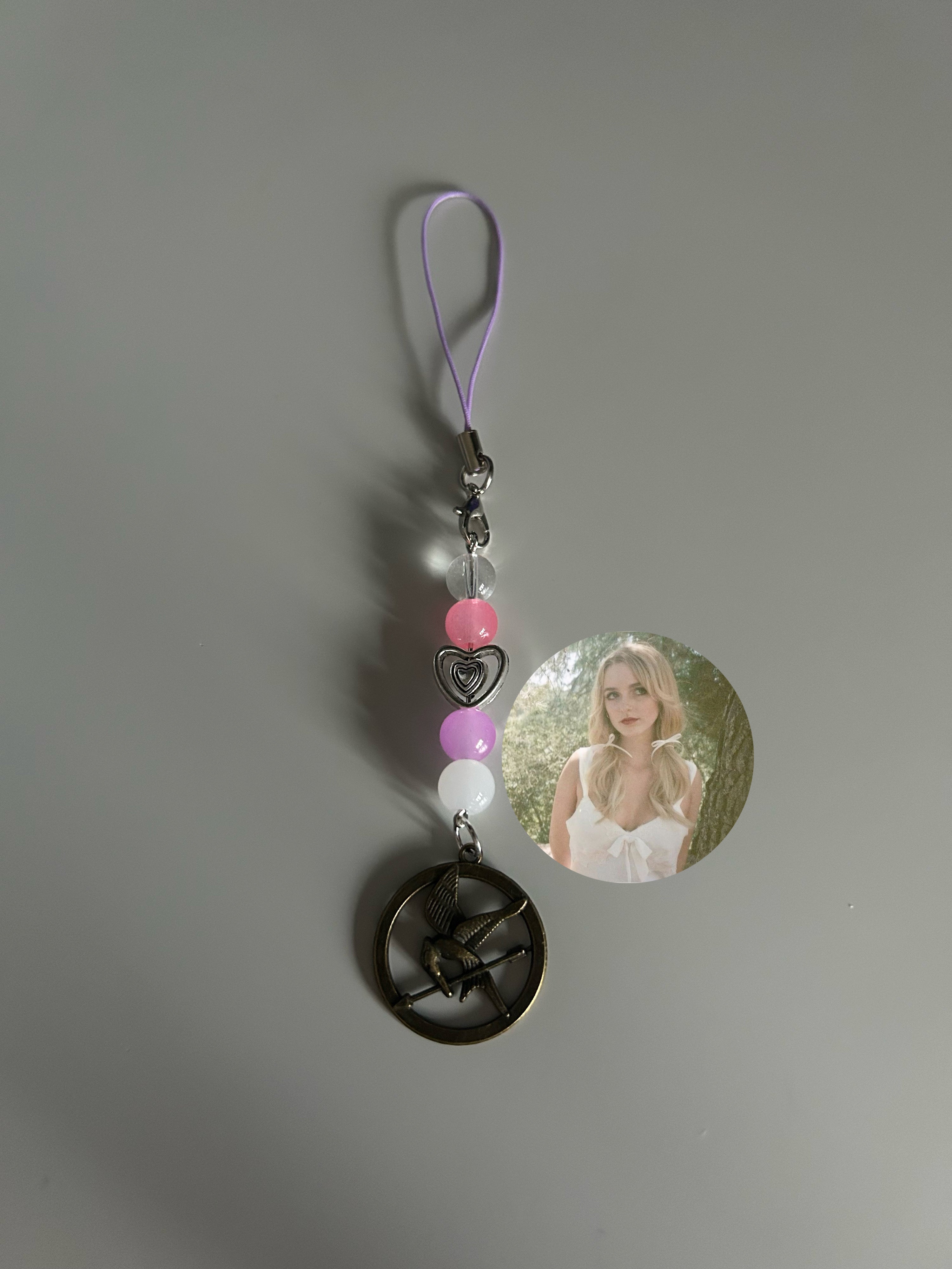 Maysilee Donner The Hunger Games Sunrise On The Reaping inspired handmade phone charm